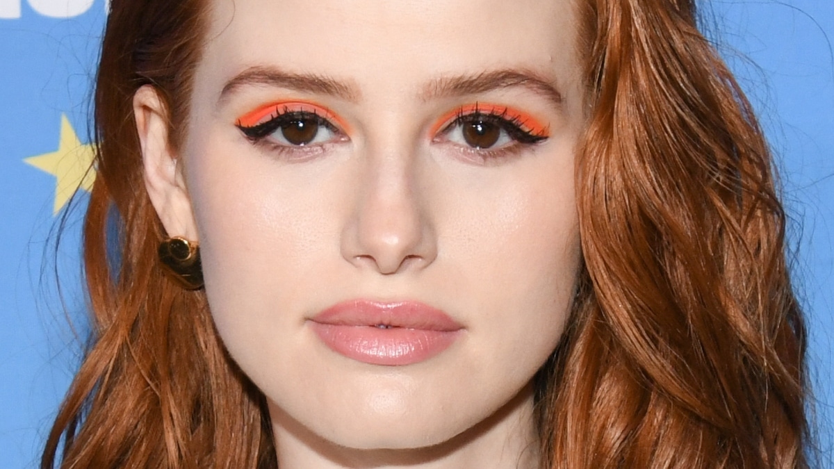 Madelaine Petsch wearing bold orange eyeliner.