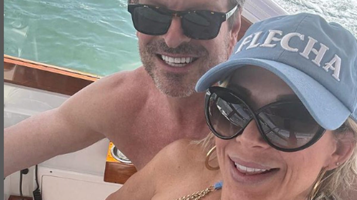 Alexis Bellino and John Janssen on a boat